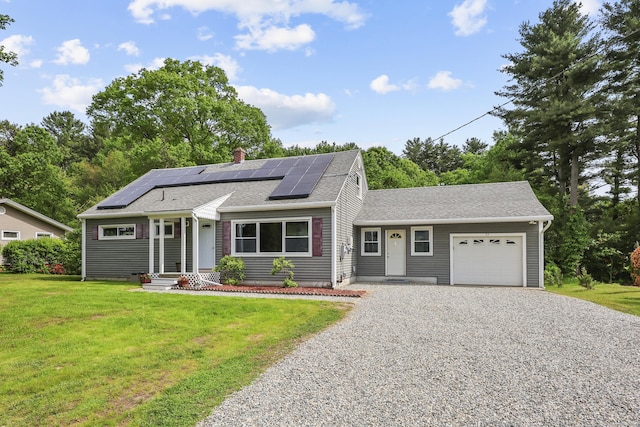 33 Jolley Rd, Plainfield, CT 06239 - view of front of home with driveway, a garage, a front lawn, roof with shingles, and roof mounted solar panels