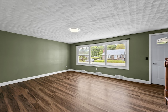 33 Jolley Rd, Plainfield, CT 06239 - empty room with baseboards, plenty of natural light, and dark wood-type flooring