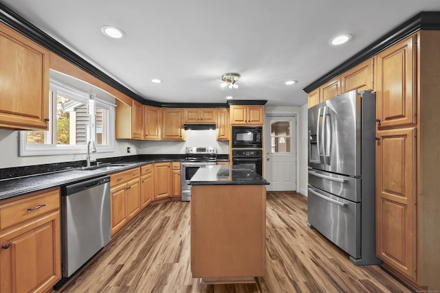 33 Jolley Rd, Plainfield, CT 06239 - kitchen featuring black appliances, a sink, under cabinet range hood, a kitchen island, and light wood-style floors