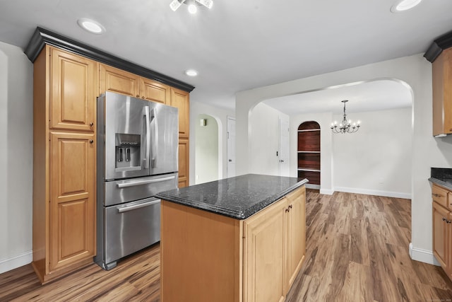 33 Jolley Rd, Plainfield, CT 06239 - kitchen with stainless steel fridge with ice dispenser, arched walkways, wood finished floors, and recessed lighting