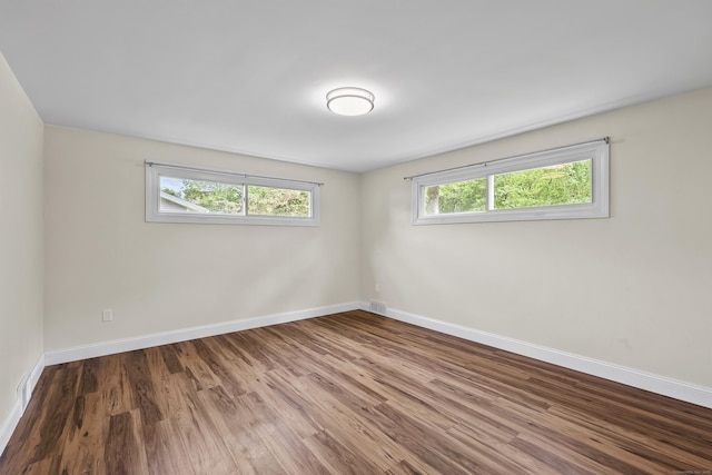 33 Jolley Rd, Plainfield, CT 06239 - empty room with wood finished floors and baseboards