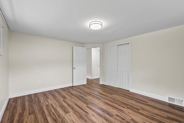 33 Jolley Rd, Plainfield, CT 06239 - unfurnished bedroom featuring wood finished floors, baseboards, and a closet