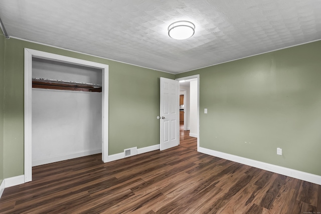 33 Jolley Rd, Plainfield, CT 06239 - unfurnished bedroom with wood finished floors, baseboards, and a closet