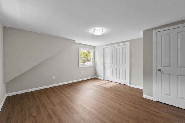 33 Jolley Rd, Plainfield, CT 06239 - unfurnished bedroom featuring wood finished floors, baseboards, and a closet