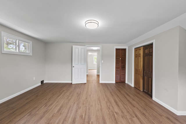 33 Jolley Rd, Plainfield, CT 06239 - unfurnished bedroom featuring wood finished floors and baseboards
