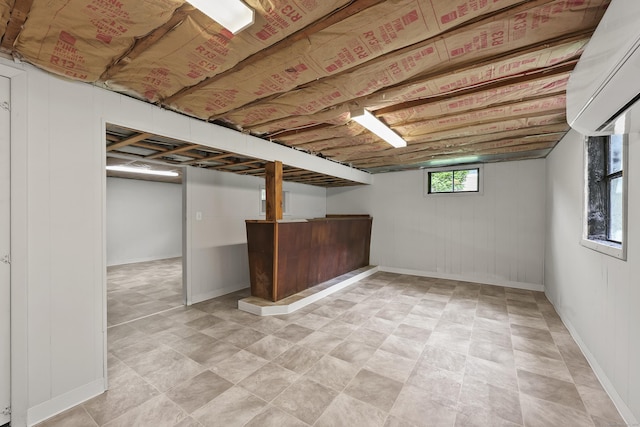 33 Jolley Rd, Plainfield, CT 06239 - below grade area with a wall unit AC, baseboards, and a bar