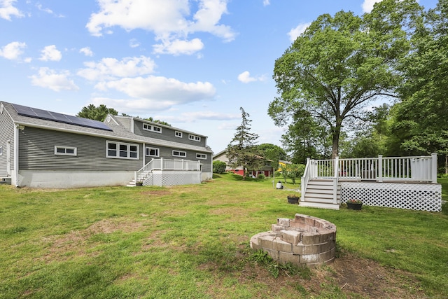 33 Jolley Rd, Plainfield, CT 06239 - view of grassy yard featuring stairs and a deck