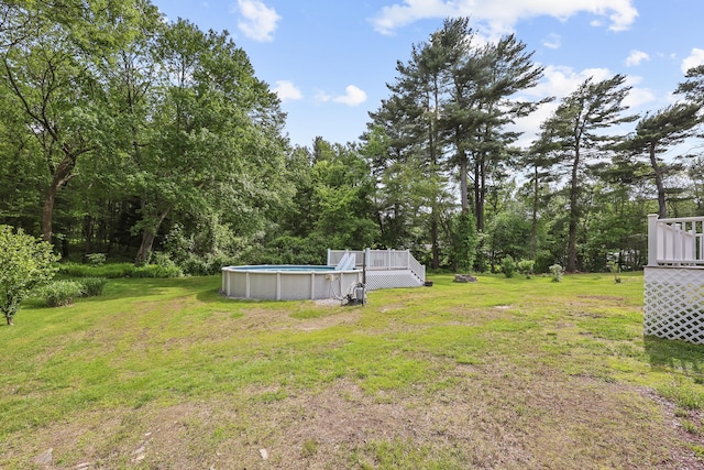 33 Jolley Rd, Plainfield, CT 06239 - view of grassy yard with an outdoor pool and a deck
