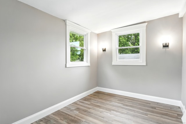 27 Prospect Ave, East Lyme, CT 06357 - unfurnished room with baseboards, light wood-style flooring, and healthy amount of natural light