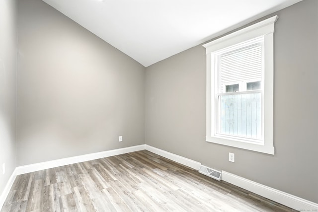 27 Prospect Ave, East Lyme, CT 06357 - spare room featuring wood finished floors, baseboards, and lofted ceiling