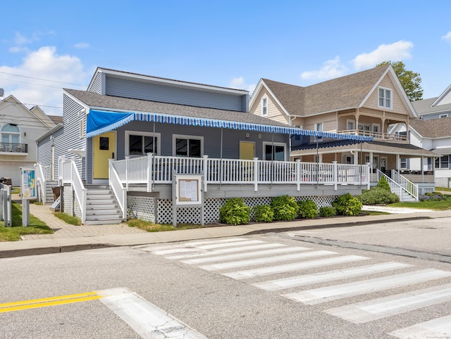 27 Prospect Ave, East Lyme, CT 06357 - view of front of home featuring covered porch, stairs, and a shingled roof