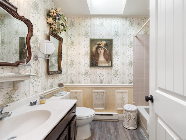 full bath with wallpapered walls, wood finished floors, toilet, a baseboard heating unit, and bathtub / shower combination