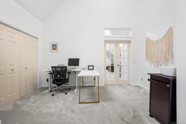 home office featuring french doors, baseboards, carpet, and high vaulted ceiling