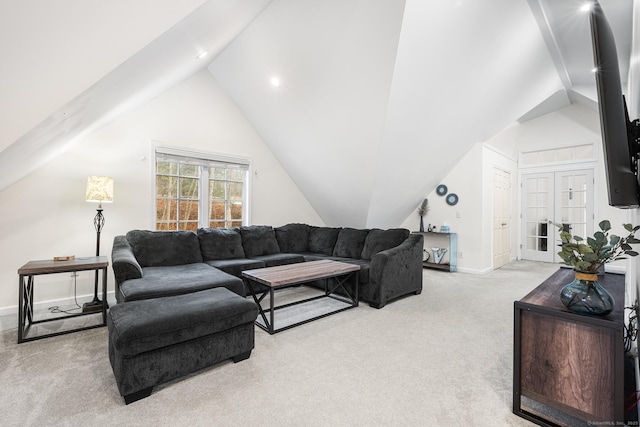 living room featuring baseboards, lofted ceiling, and light carpet