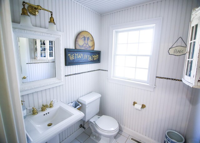 6 Rogers Dr, Stonington, CT 06355 - half bathroom featuring toilet, tile patterned floors, and a sink