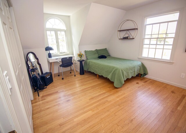 6 Rogers Dr, Stonington, CT 06355 - bedroom featuring wood-type flooring, lofted ceiling, and baseboards