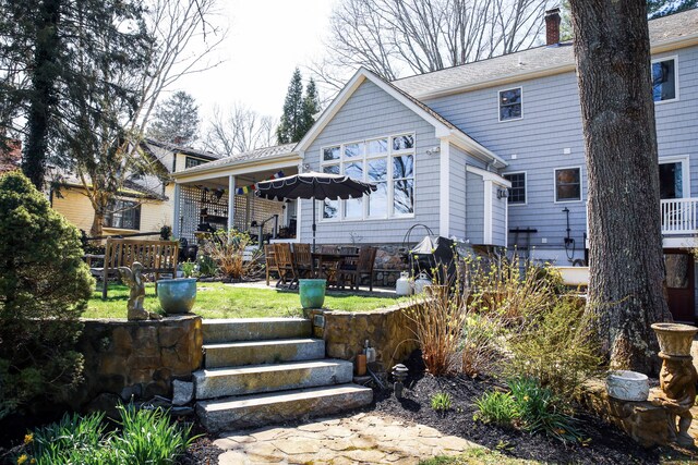 6 Rogers Dr, Stonington, CT 06355 - rear view of house with a chimney, a yard, and a patio area