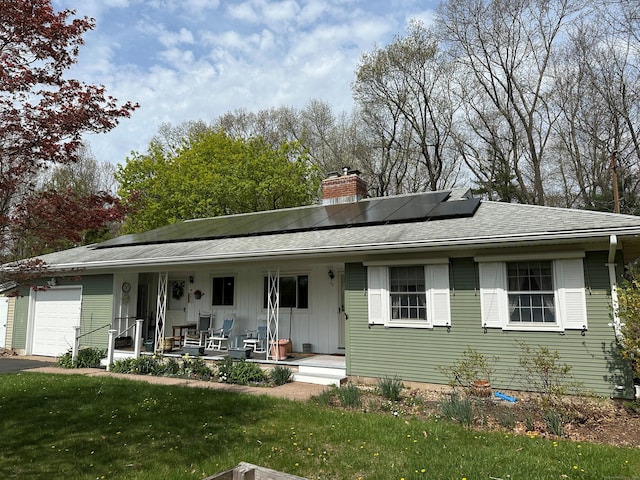 38 Somerset Dr, Manchester, CT 06040 - view of front facade with covered porch, a chimney, a garage, a shingled roof, and a front yard