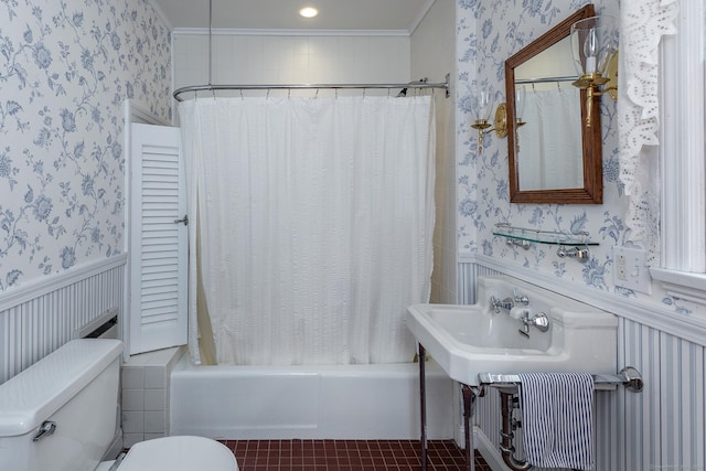 full bath featuring wallpapered walls, toilet, a wainscoted wall, and shower / bathtub combination with curtain