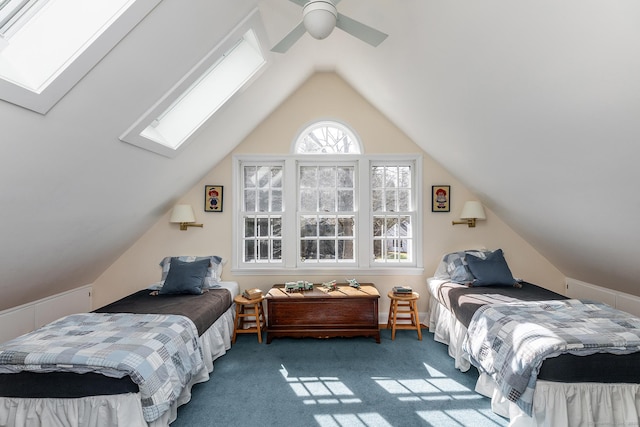 bedroom with carpet, a ceiling fan, and lofted ceiling with skylight