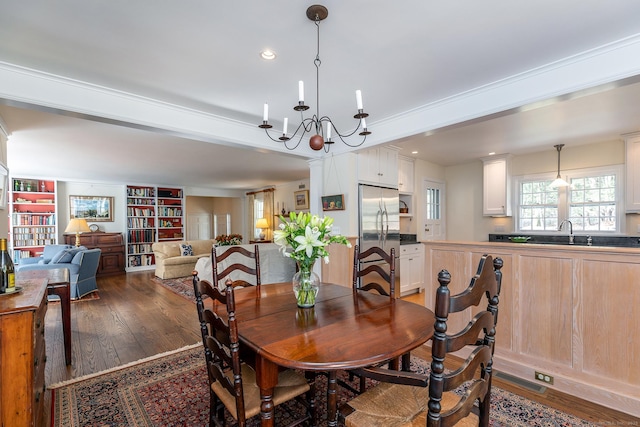 dining room featuring wood-type flooring, a chandelier, and recessed lighting