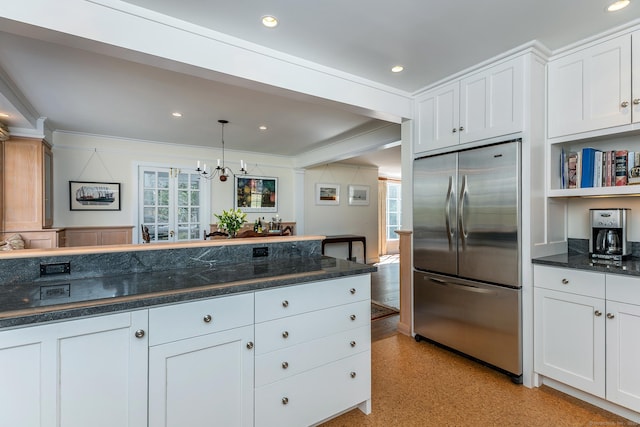 kitchen featuring a notable chandelier, white cabinets, ornamental molding, and stainless steel built in fridge