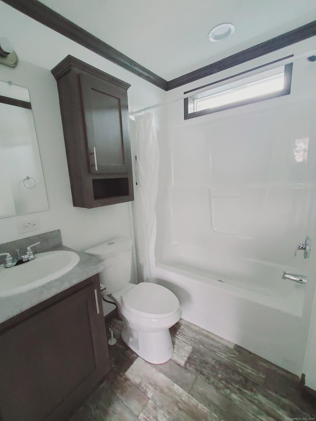 bathroom with toilet, shower / tub combo, wood finished floors, and vanity