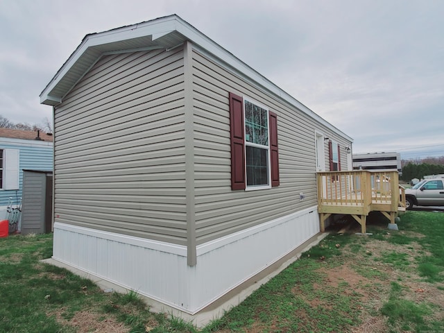 view of property exterior featuring a deck