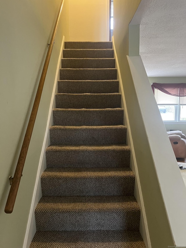 51 Mortimer St Apt 9, Torrington, CT 06790 - stairway with a textured ceiling