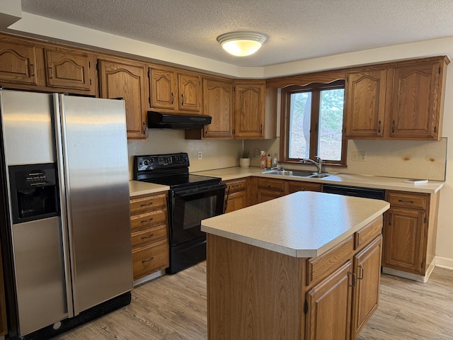 278 Dudley Town Rd, Windsor, CT 06095 - kitchen featuring stainless steel fridge, black electric range oven, a sink, under cabinet range hood, and a textured ceiling