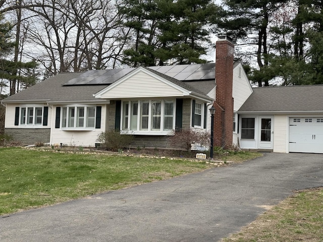 278 Dudley Town Rd, Windsor, CT 06095 - single story home featuring a garage, solar panels, a chimney, and a front yard