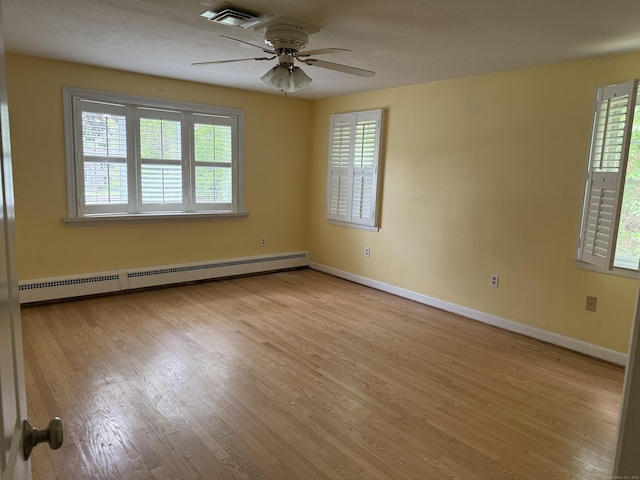 278 Dudley Town Rd, Windsor, CT 06095 - spare room featuring baseboard heating, ceiling fan, wood finished floors, and healthy amount of natural light