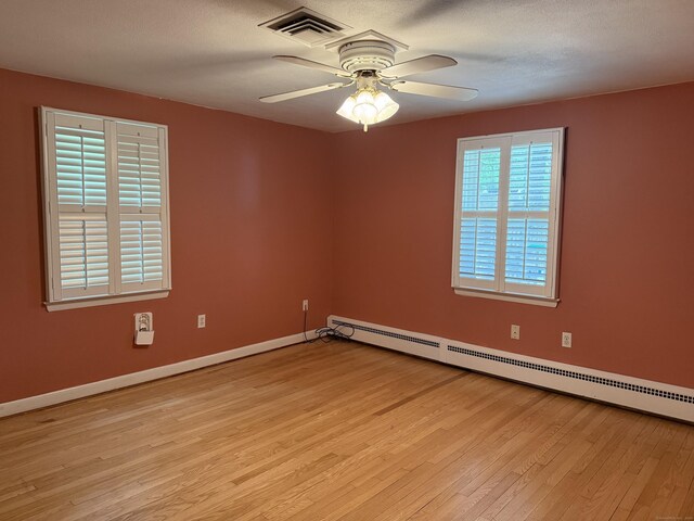 278 Dudley Town Rd, Windsor, CT 06095 - unfurnished room featuring light wood-style floors, a baseboard radiator, ceiling fan, and baseboards