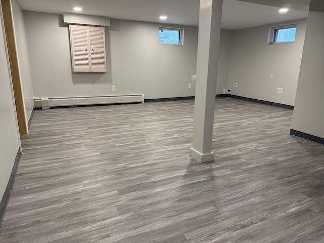 278 Dudley Town Rd, Windsor, CT 06095 - below grade area featuring baseboard heating, baseboards, wood finished floors, recessed lighting, and healthy amount of natural light
