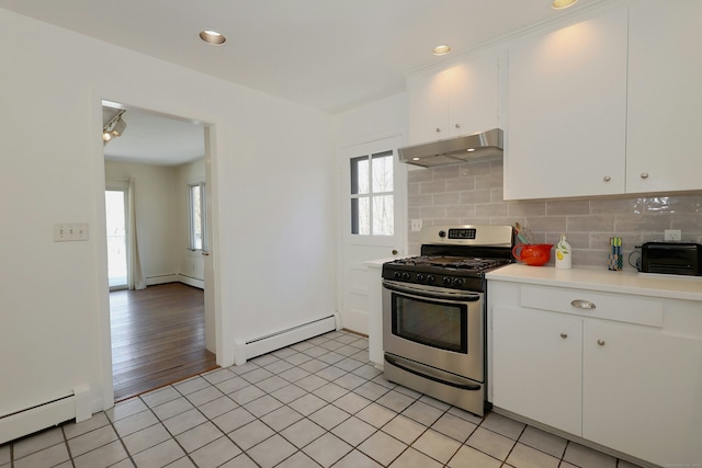 45 Wayside Ln, Redding, CT 06896 - kitchen featuring a baseboard radiator, stainless steel gas range, under cabinet range hood, light countertops, and recessed lighting