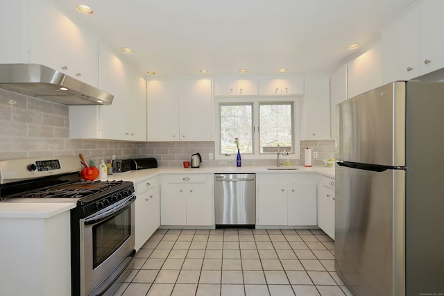 45 Wayside Ln, Redding, CT 06896 - kitchen featuring appliances with stainless steel finishes, under cabinet range hood, a sink, light countertops, and recessed lighting