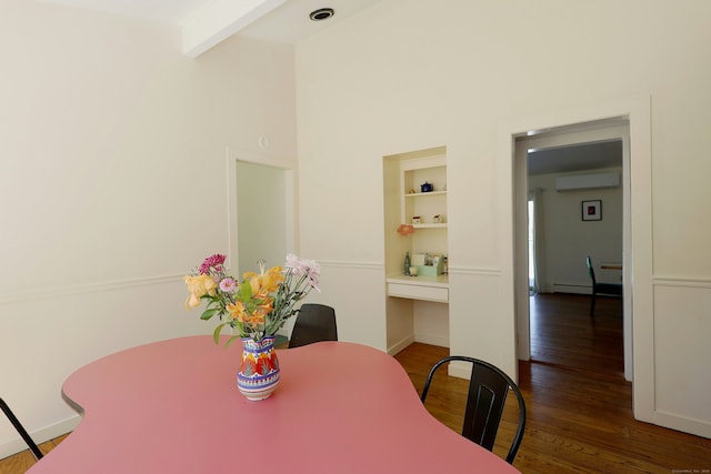45 Wayside Ln, Redding, CT 06896 - dining room featuring a wall mounted air conditioner, wood finished floors, beamed ceiling, built in shelves, and baseboards