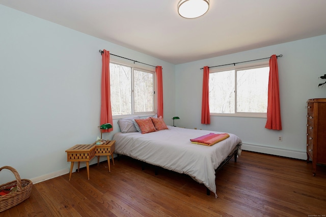 45 Wayside Ln, Redding, CT 06896 - bedroom featuring baseboard heating, wood finished floors, and baseboards