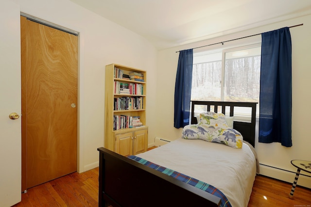 45 Wayside Ln, Redding, CT 06896 - bedroom with wood finished floors and baseboard heating