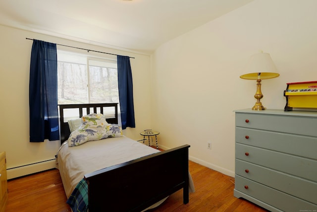 45 Wayside Ln, Redding, CT 06896 - bedroom with a baseboard radiator, wood finished floors, and baseboards