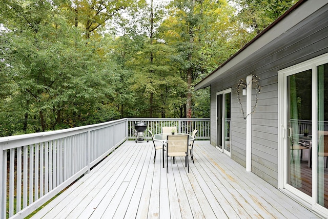 45 Wayside Ln, Redding, CT 06896 - wooden deck featuring outdoor dining space and view of wooded area