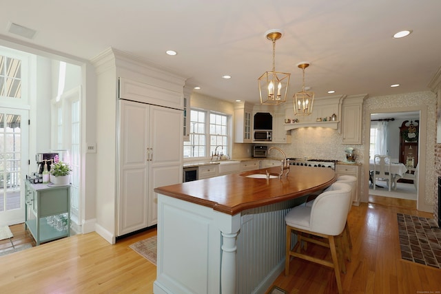 37 Giles Hill Rd, Redding, CT 06896 - kitchen with a sink, wood counters, light wood-type flooring, and a notable chandelier