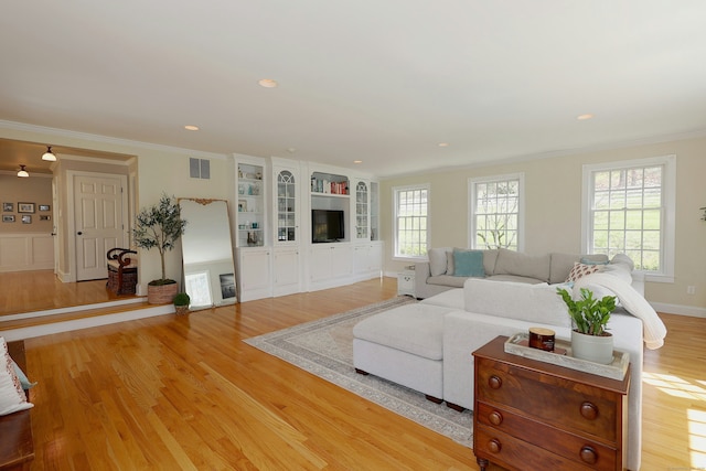 37 Giles Hill Rd, Redding, CT 06896 - living room with visible vents, ornamental molding, and light wood-style flooring