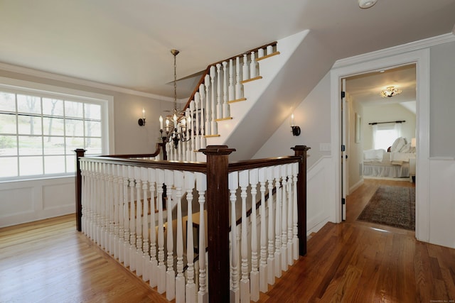 37 Giles Hill Rd, Redding, CT 06896 - staircase featuring ornamental molding, a decorative wall, and wood finished floors