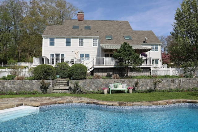 37 Giles Hill Rd, Redding, CT 06896 - rear view of house featuring stairway, fence, a fenced in pool, and a chimney