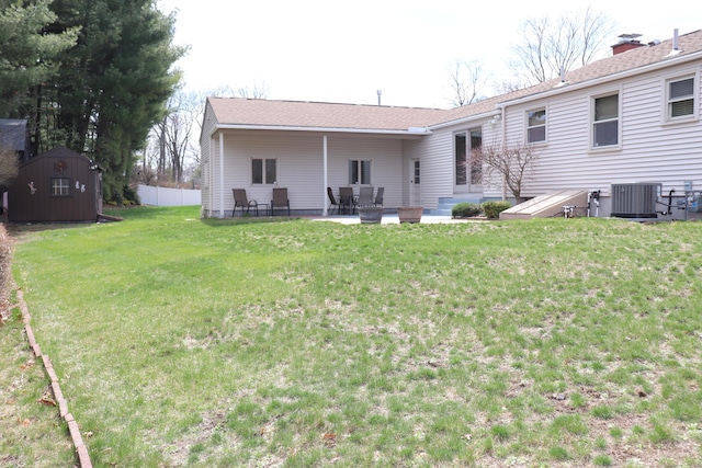 1 Sunrise Cir, Enfield, CT 06082 - back of house featuring a yard, fence, a patio, central air condition unit, and an outbuilding
