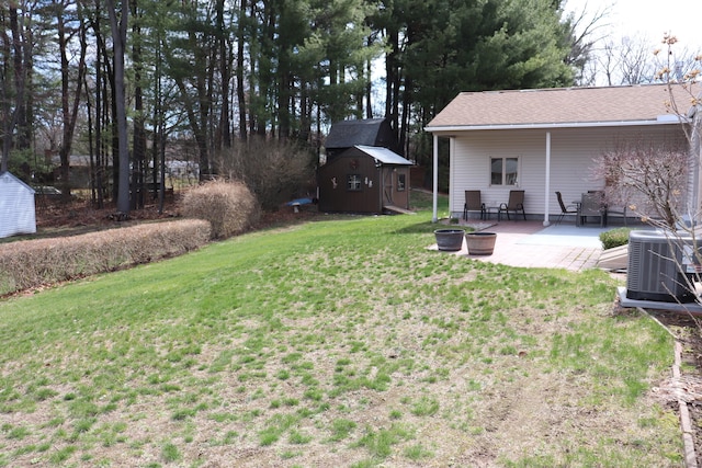 1 Sunrise Cir, Enfield, CT 06082 - view of yard featuring an outbuilding, a patio area, central AC unit, and a storage unit