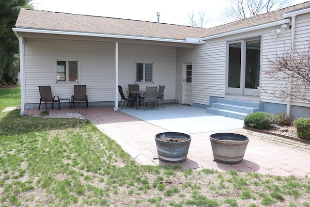 1 Sunrise Cir, Enfield, CT 06082 - back of property with a yard, roof with shingles, entry steps, and a patio area