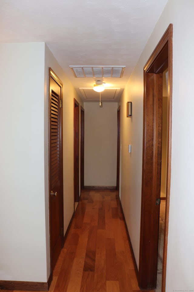 1 Sunrise Cir, Enfield, CT 06082 - corridor with light wood-style floors, attic access, baseboards, and visible vents