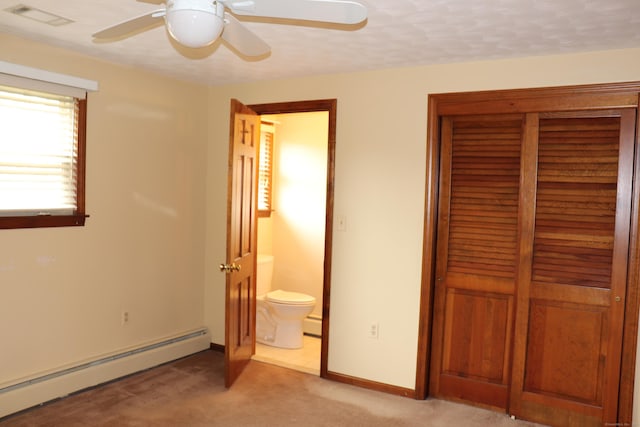 1 Sunrise Cir, Enfield, CT 06082 - unfurnished bedroom with a closet, a baseboard heating unit, ensuite bathroom, visible vents, and light colored carpet